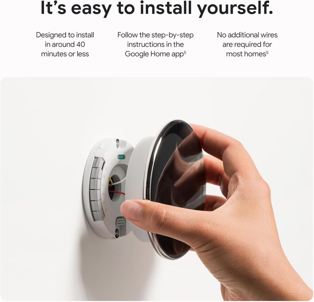 Hand snapping Nest thermostat onto base during simple DIY installation